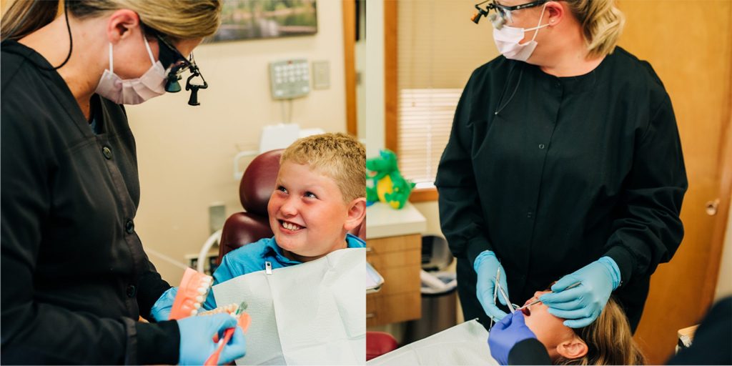Dental assistant talking to child about brushing teeth.